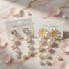 12 Aretes Perlas Colgantes con Pedreria $13.7 c/u